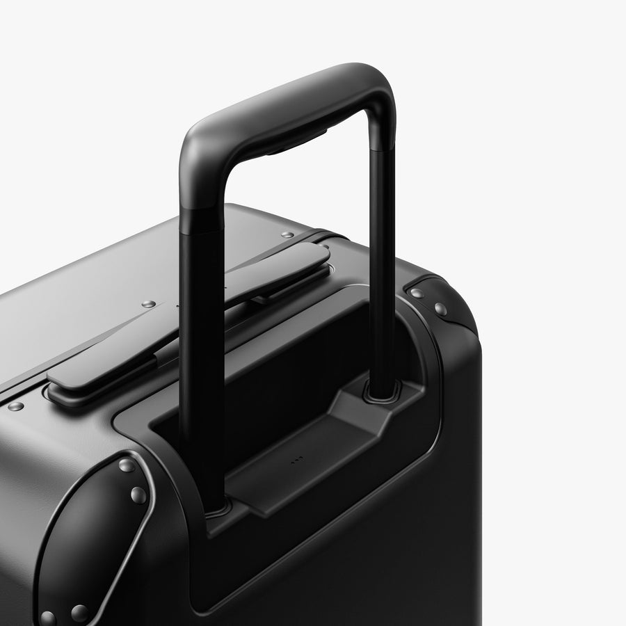 Obsidian | Extended luggage handle view of Hybrid Carry-On in Obsidian