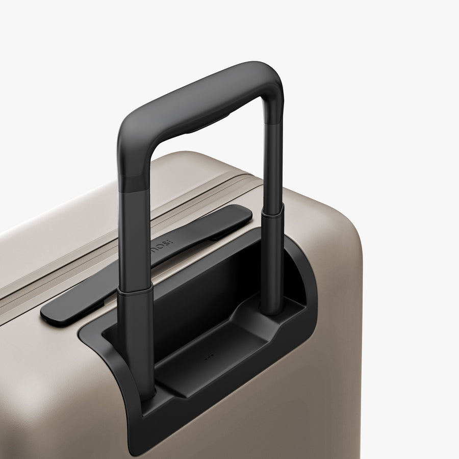 Desert Taupe | Extended luggage handle view of Carry-On Pro in Desert Taupe